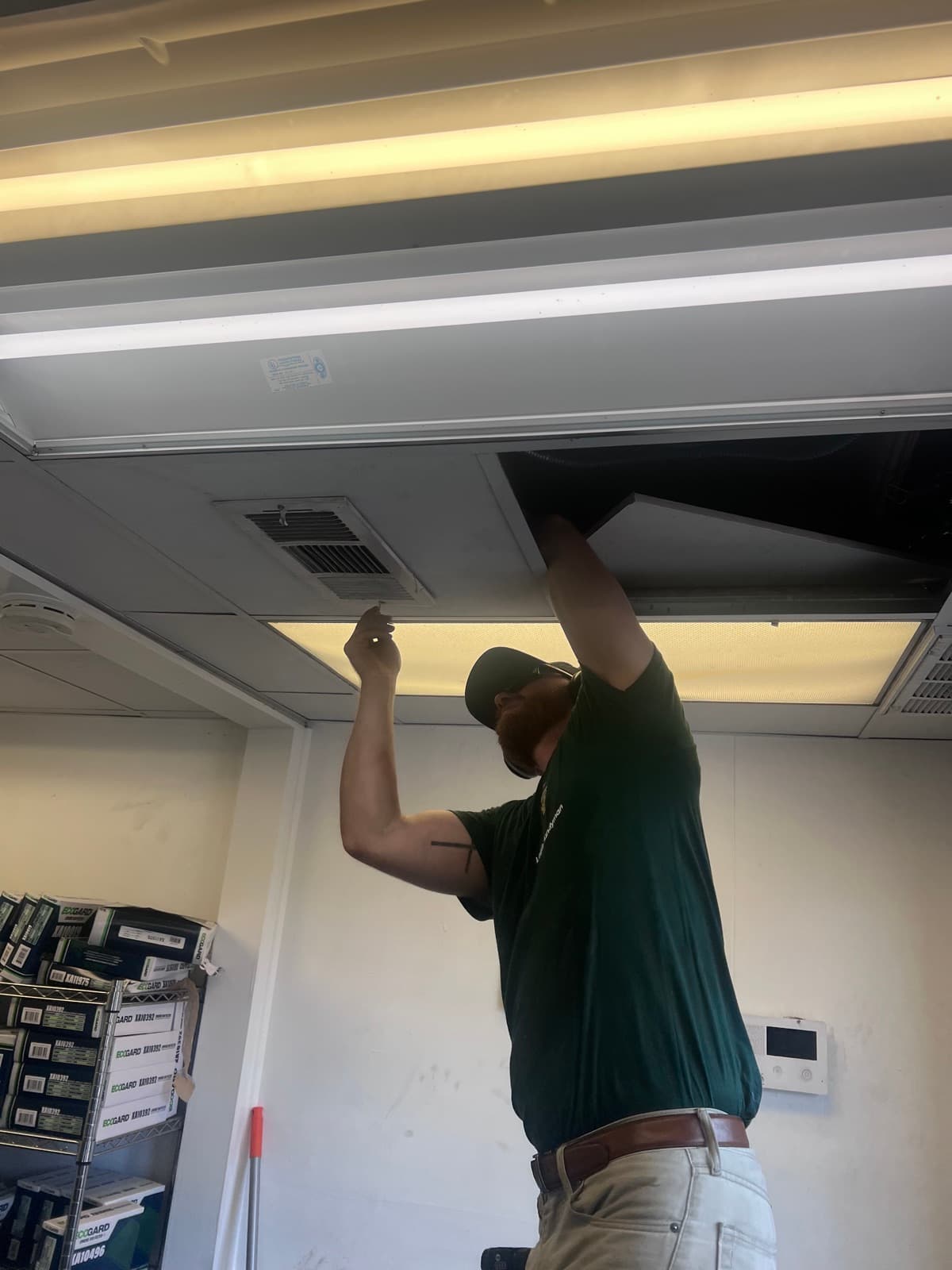 Technician servicing HVAC filter